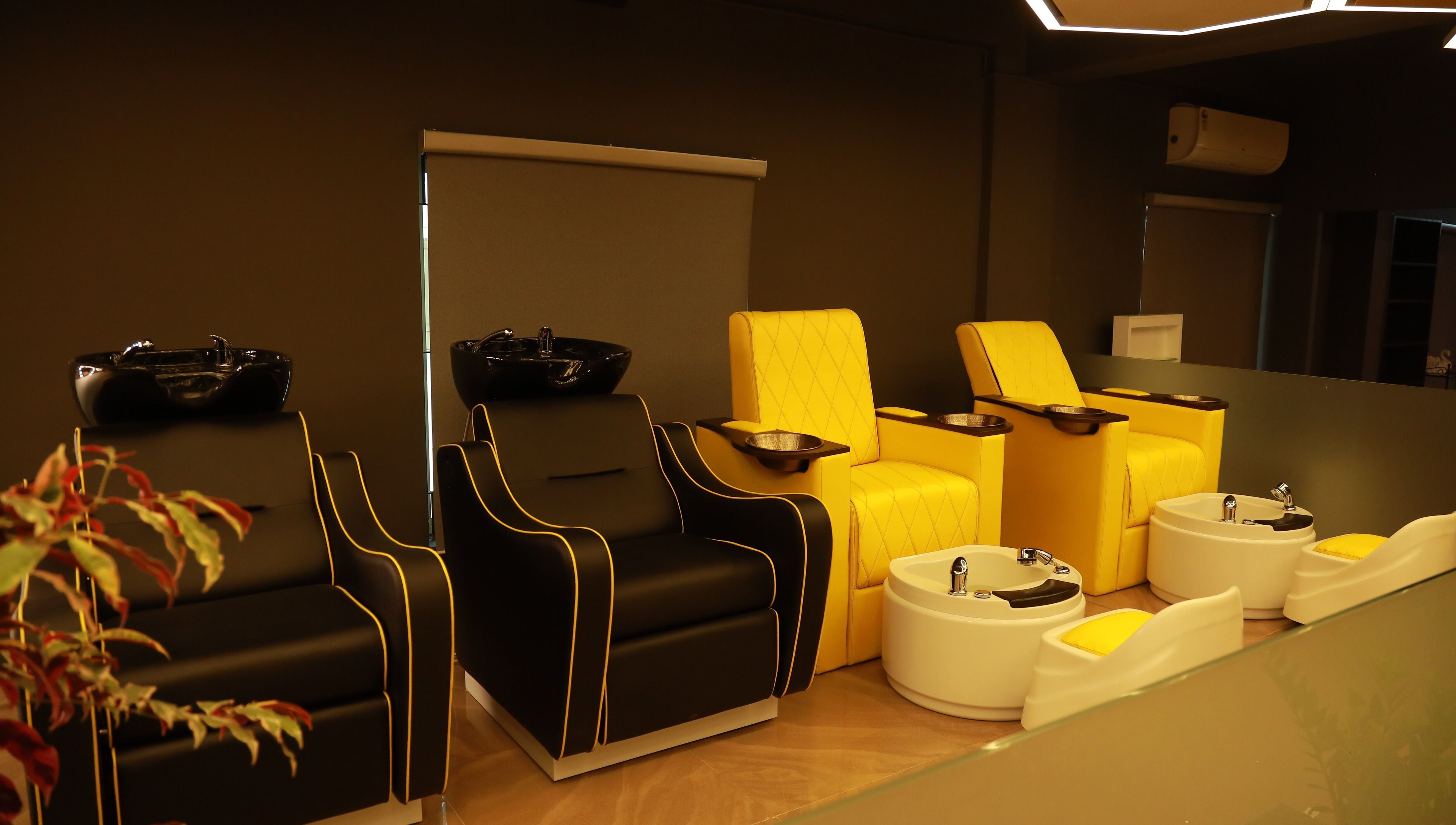 Elegant pedicure chairs at One Touch Fit & Glam, Thiruvananthapuram, Kerala, IN, offering luxury wellness.