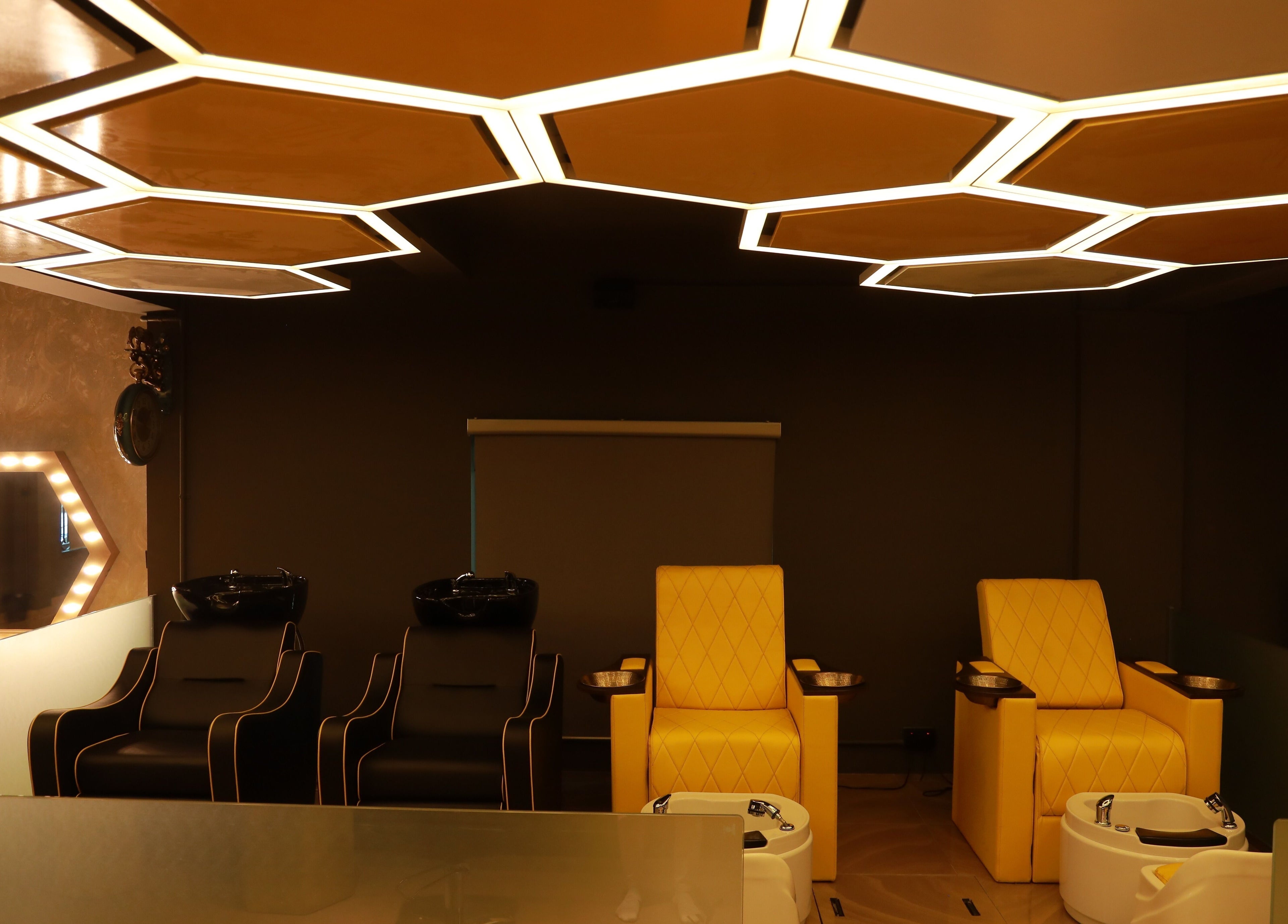 Luxurious salon chairs and unique lighting at One Touch Fit & Glam in Thiruvananthapuram, Kerala, IN.