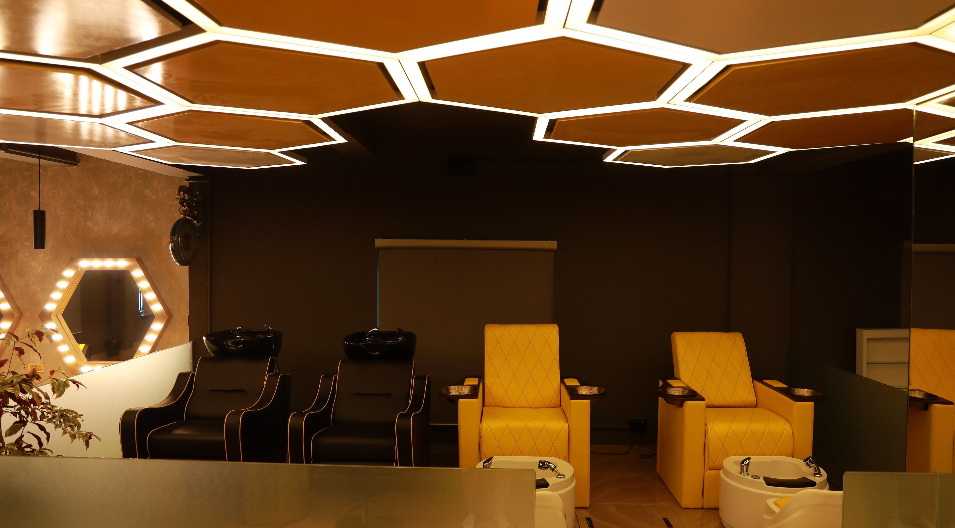 Luxurious salon chairs and unique lighting at One Touch Fit & Glam in Thiruvananthapuram, Kerala, IN.