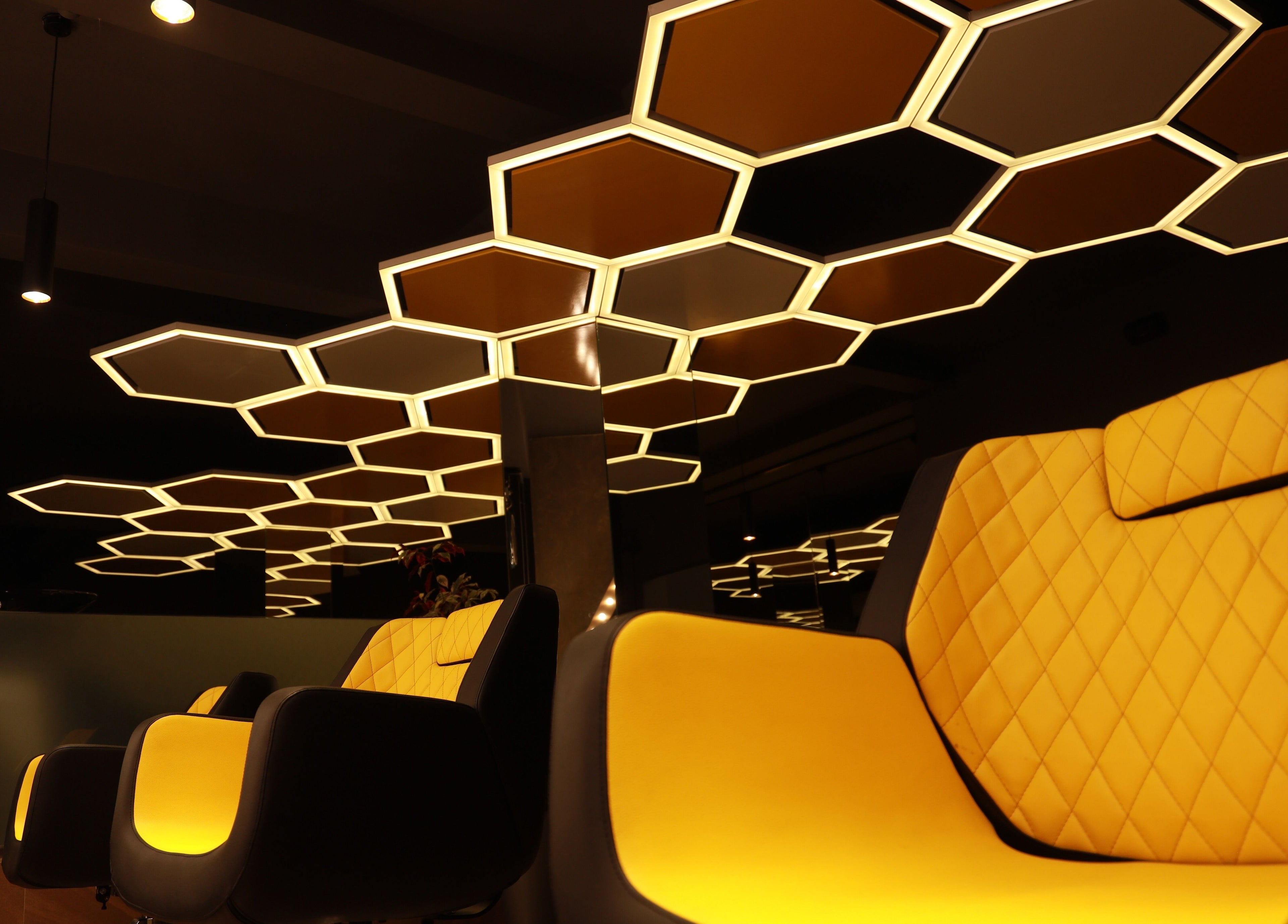 Stylish seating and modern lighting at One Touch Fit & Glam, Thiruvananthapuram, Kerala, IN.