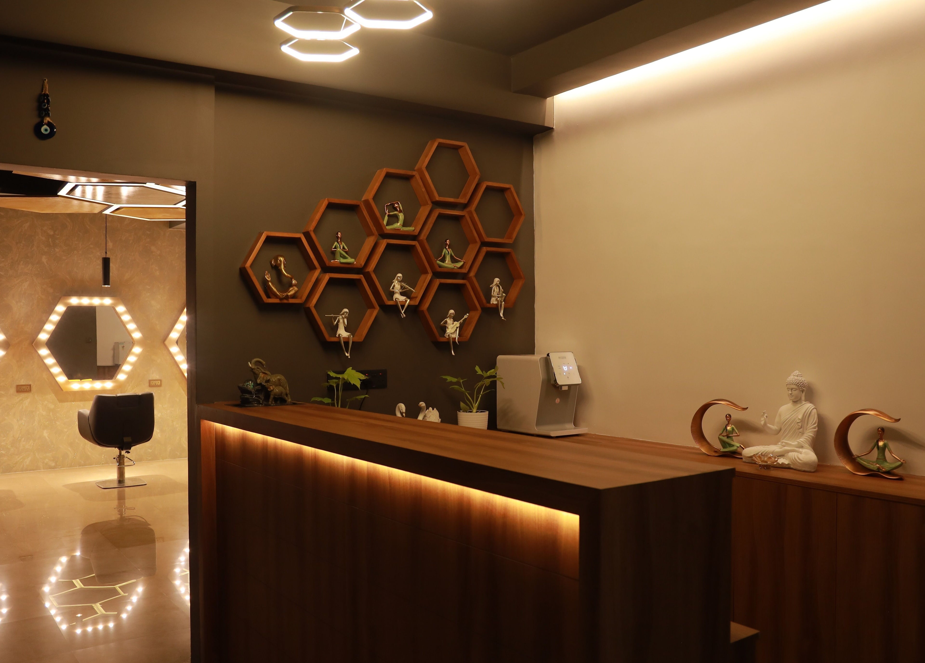 Modern interior at One Touch Fit & Glam in Thiruvananthapuram, Kerala featuring elegant lighting and decor.