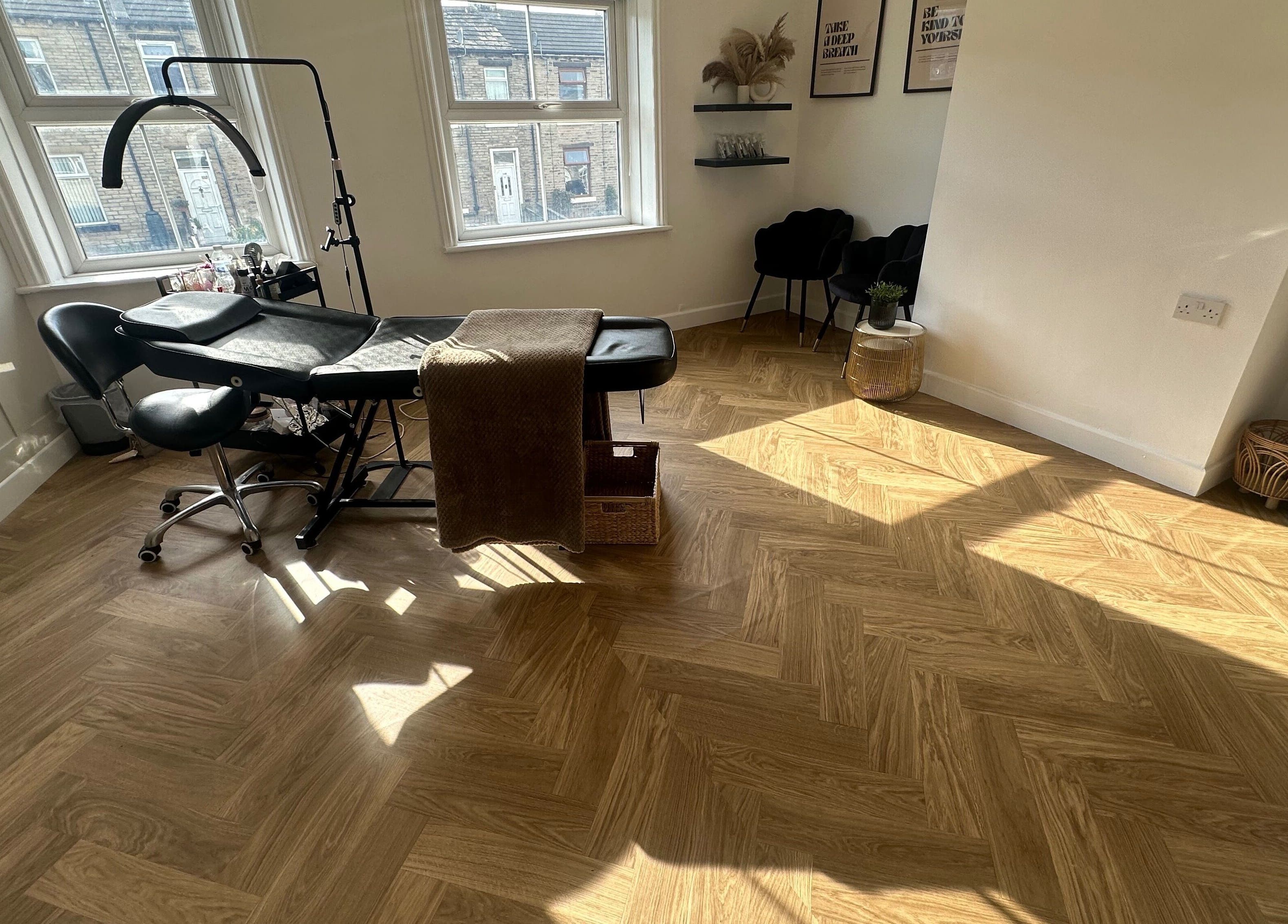 Elegant treatment room at LURA with stylish decor and soft lighting, located in Wyke, England, GB.