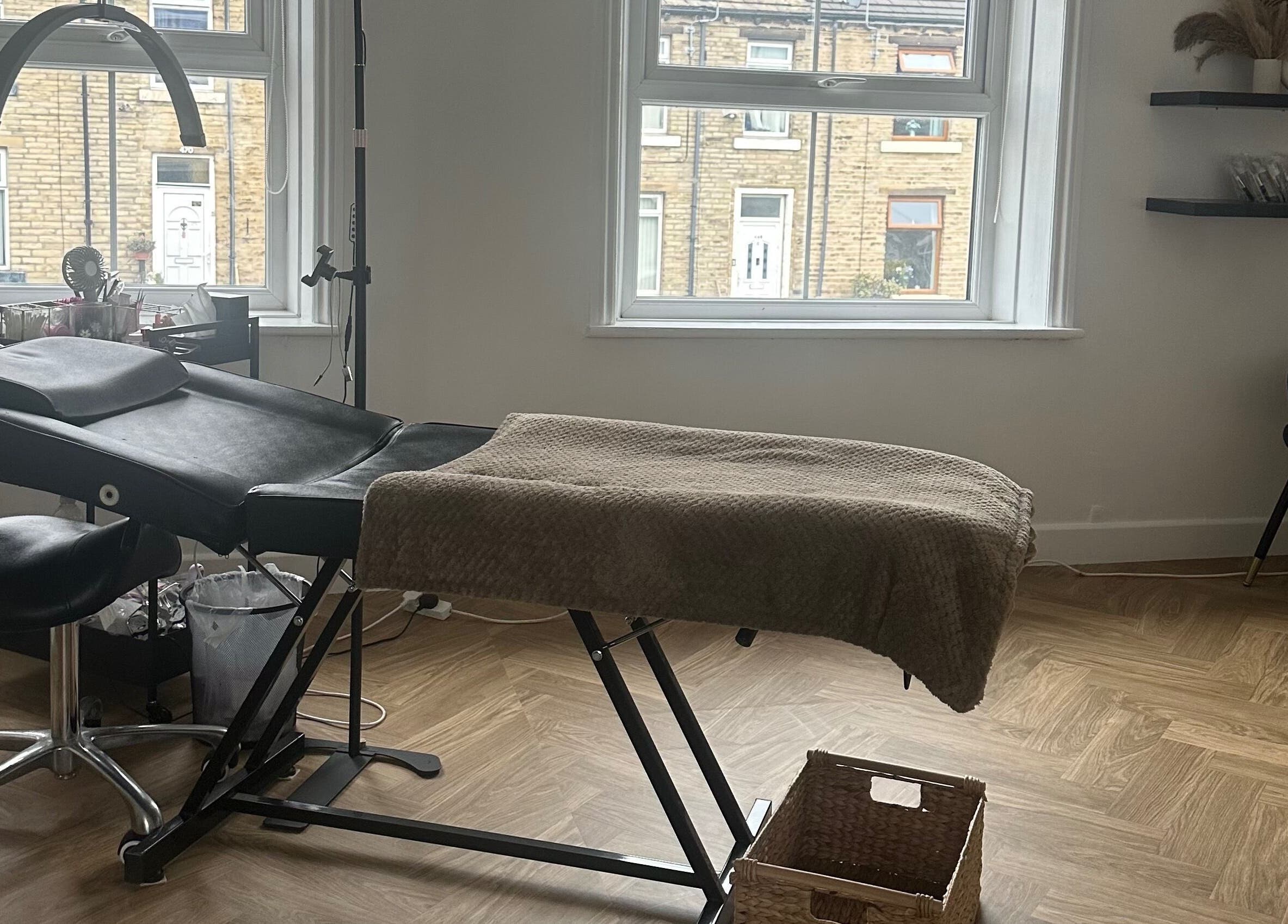Cozy treatment room at LURA, Wyke, England, GB, featuring a comfortable massage chair and serene decor.