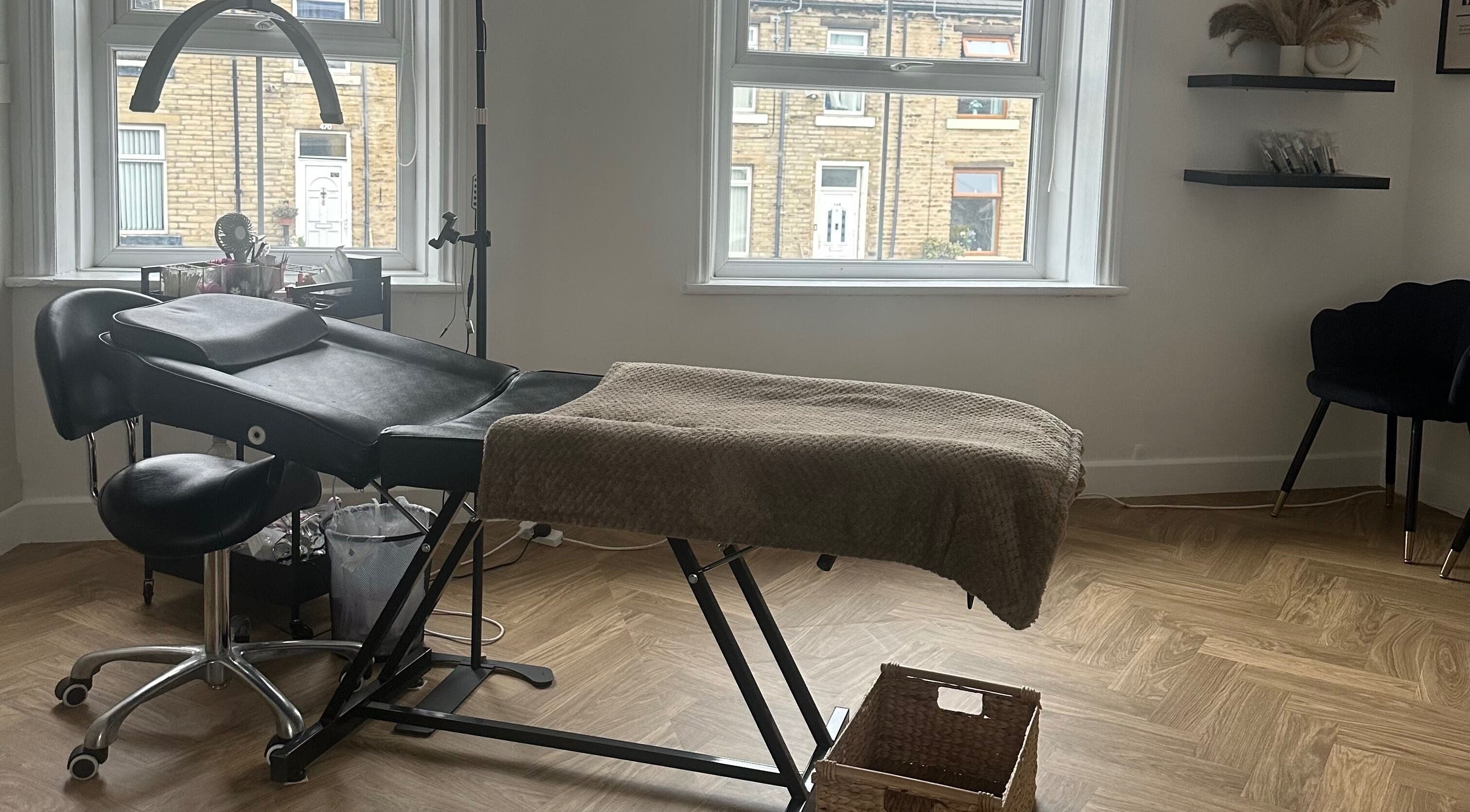 Cozy treatment room at LURA, Wyke, England, GB, featuring a comfortable massage chair and serene decor.
