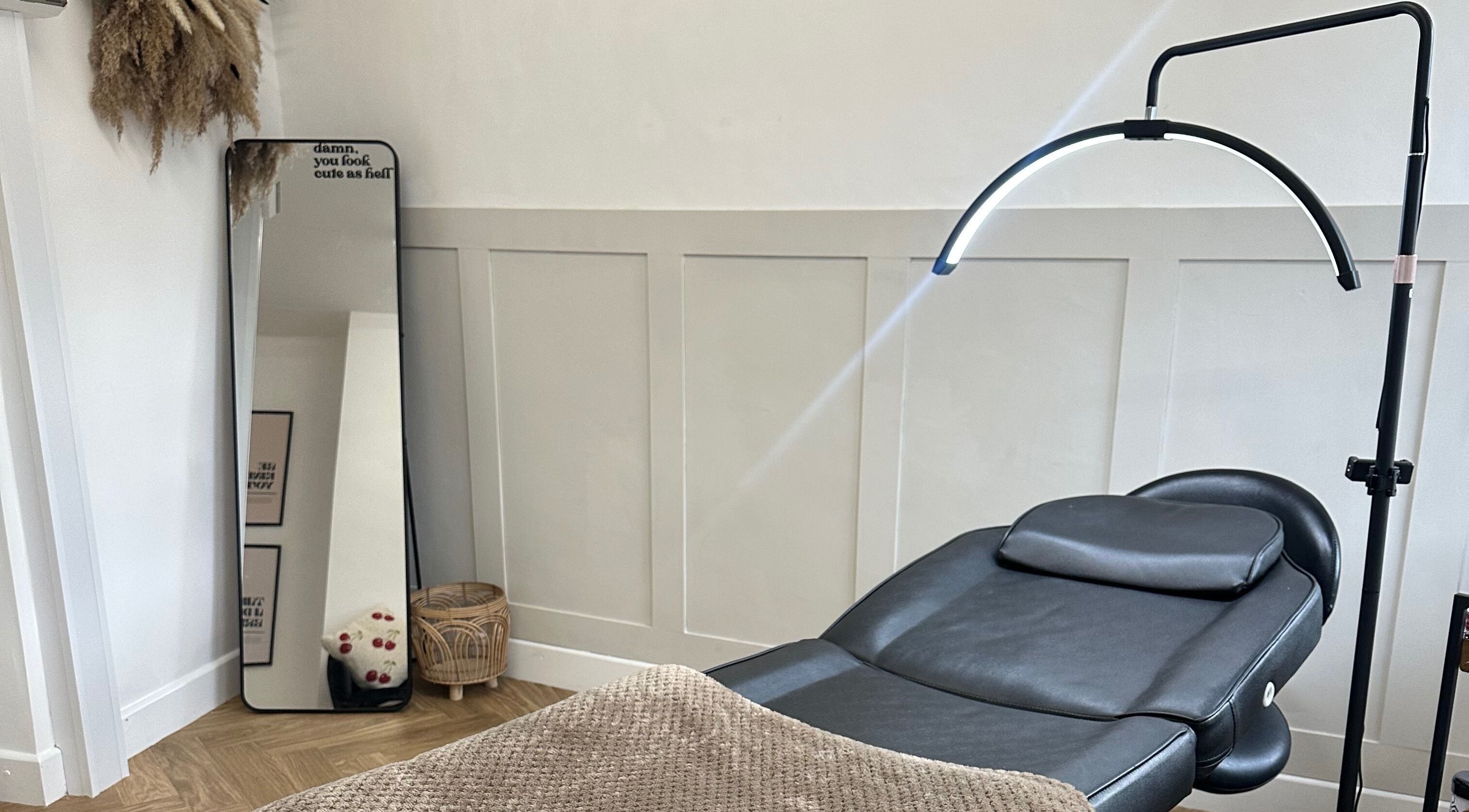 Relaxing treatment room at LURA, Wyke, England, GB, featuring a sleek chair and modern decor.