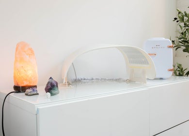 Tranquil spa setup at Ana Clara Barreto Beauty in London, England, GB with glowing salt lamp and greenery.
