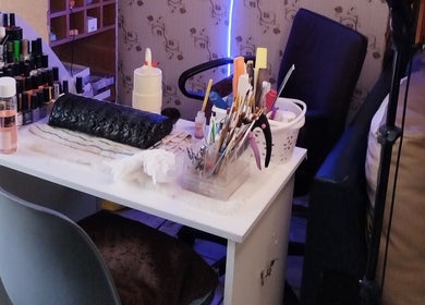 Nail art station at TheTouch by leoRock, Johannesburg, Gauteng, ZA, offering a variety of nail polish colors and tools.