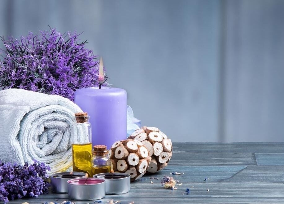 Tranquil spa setup at Prada Massage Spa, Washington, District Of Columbia, US with lavender and candles.