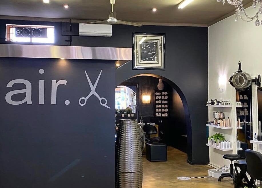 Modern salon interior at TD Hairstudio in Cape Town, Western Cape, ZA, featuring stylish decor and beauty products.