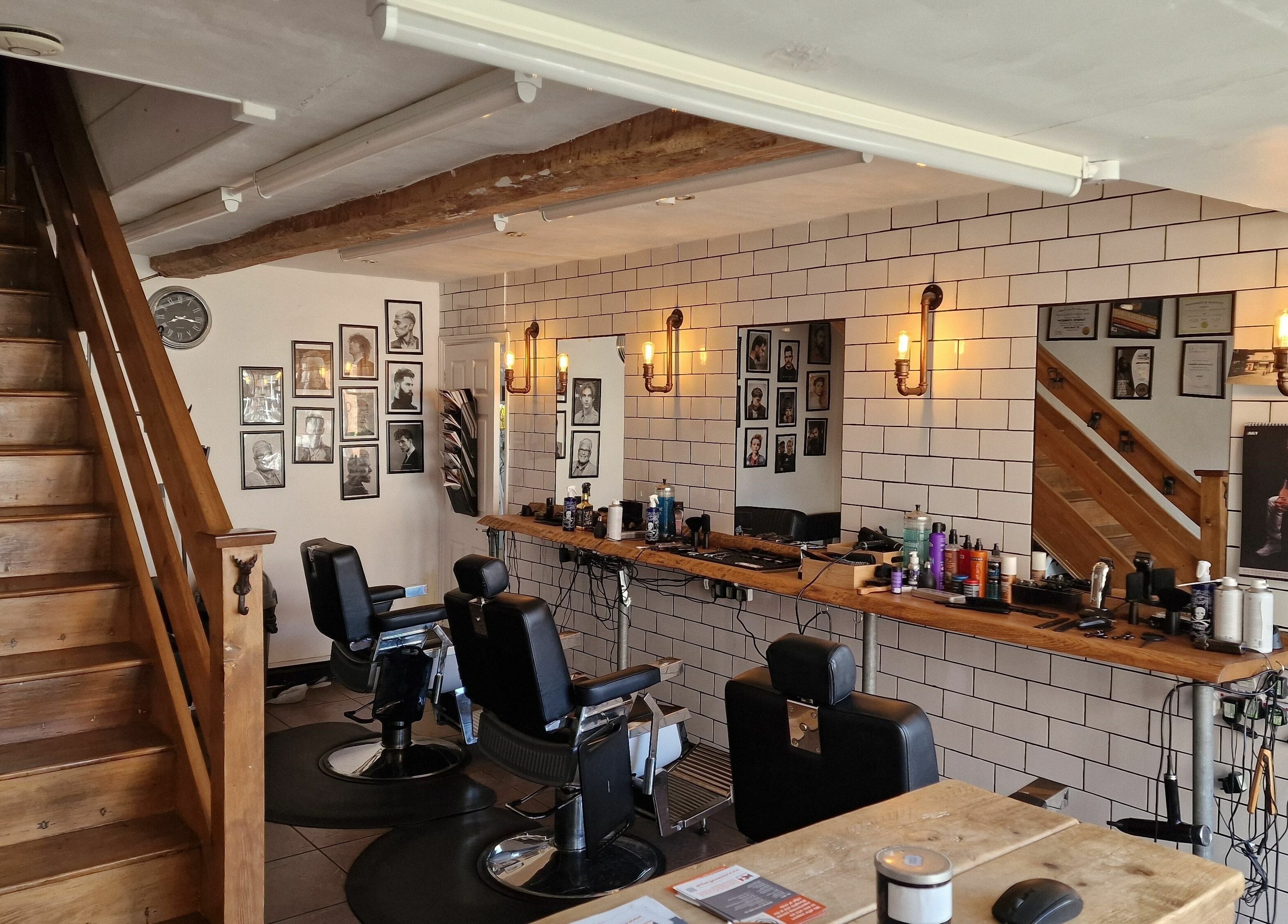 Elegant barber shop interior at Handsomes of Harleston in Harleston, England, GB with stylish decor and seating.