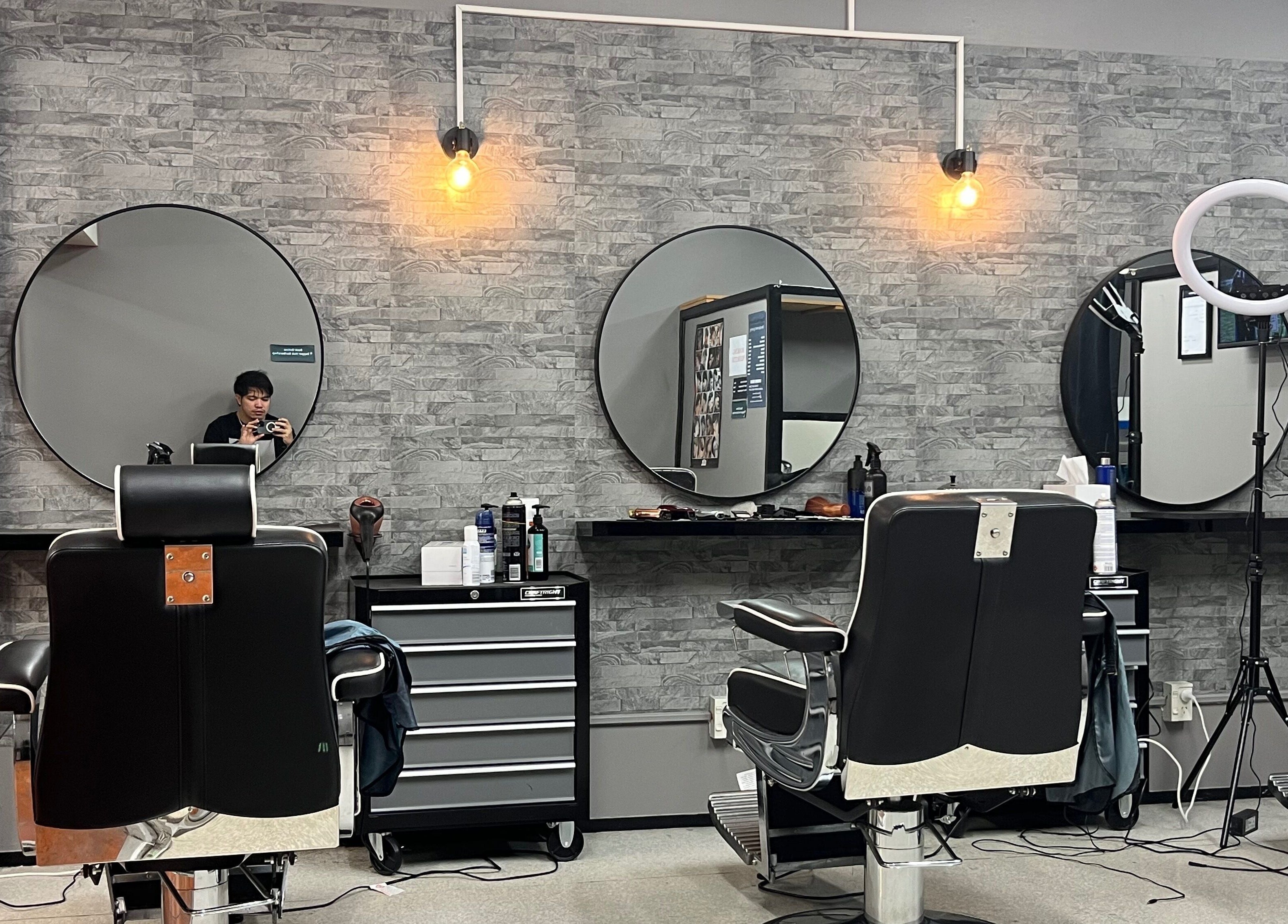 Dapper Hub Barbershop- PANMURE interior with stylish decor and barber chairs, located in Auckland, Auckland, NZ.