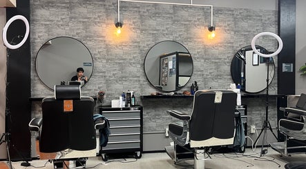 Dapper Hub Barbershop- PANMURE interior with stylish decor and barber chairs, located in Auckland, Auckland, NZ.