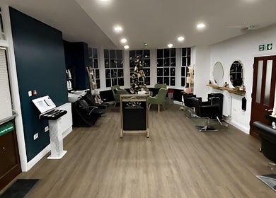 Interior of Evolve Salon, Clacton-on-sea, England, GB, showcasing stylish chairs and large windows.