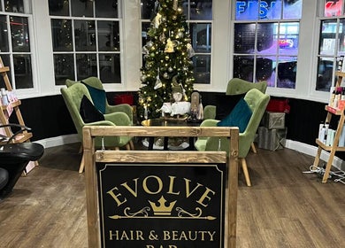 Evolve Salon in Clacton-on-sea, England, GB, beautifully decorated for the holidays with elegant seating and festive decor.