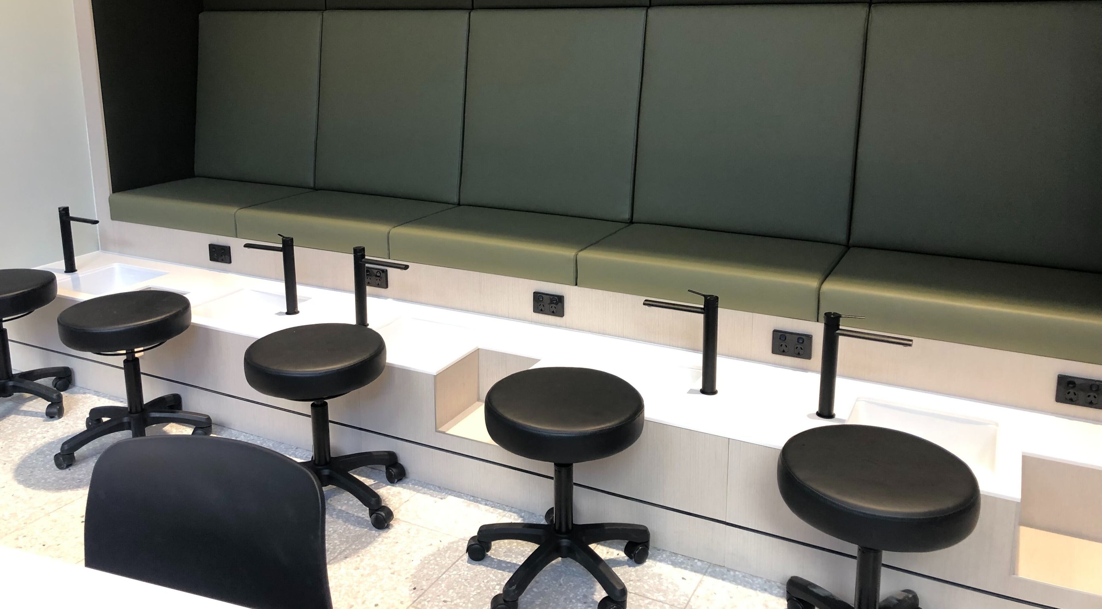 Modern nail station at Beauty Bar at David Jones, Sydney, New South Wales, AU, featuring sleek stools and basins.
