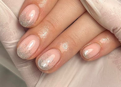 Elegant glitter manicured nails at Mais Nails, Barry, Wales, GB. Perfect for a chic, polished look.
