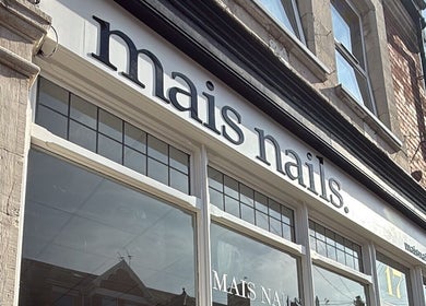 Front view of Mais Nails shop in Barry, Wales, GB showcasing elegant store signage.