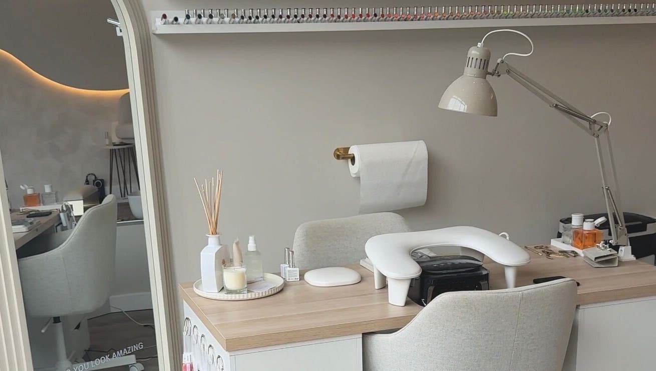 Mais Nails workspace in Barry, Wales, GB with chic decor and nail polish display.
