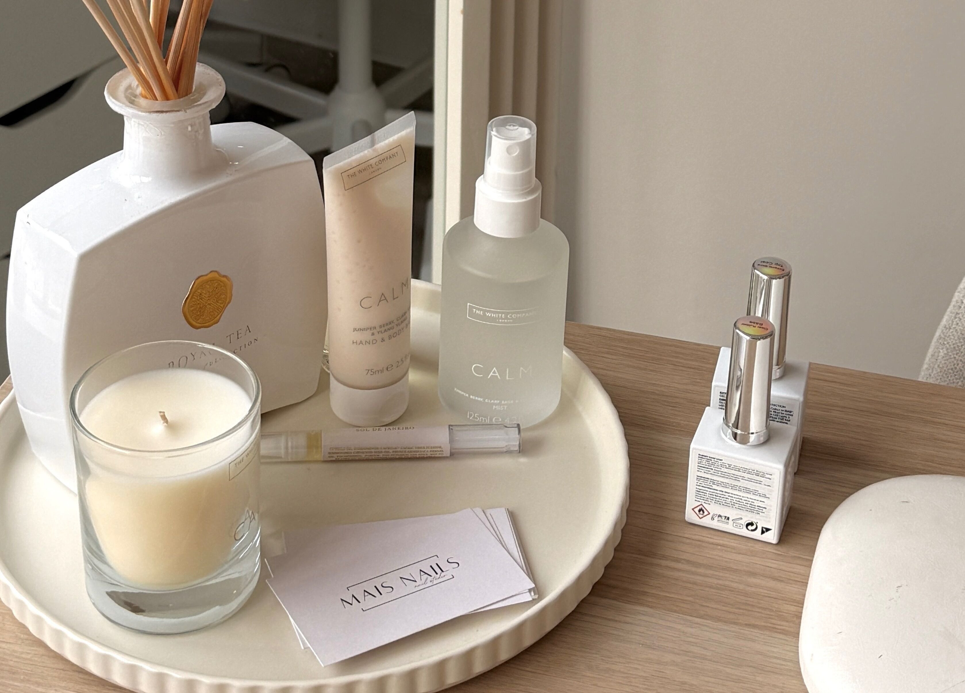 Relaxing beauty setup at Mais Nails, Barry, Wales, GB with candles and products.