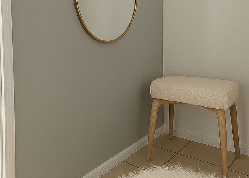 Cozy, stylish corner at LÚME HAUS Aesthetics in Wavell Heights, Queensland, AU with a mirror and stool.