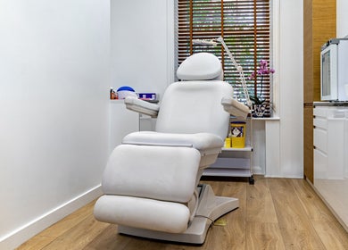 Relaxing treatment chair in Crystal Medica, London, England, GB, featuring modern wellness equipment.