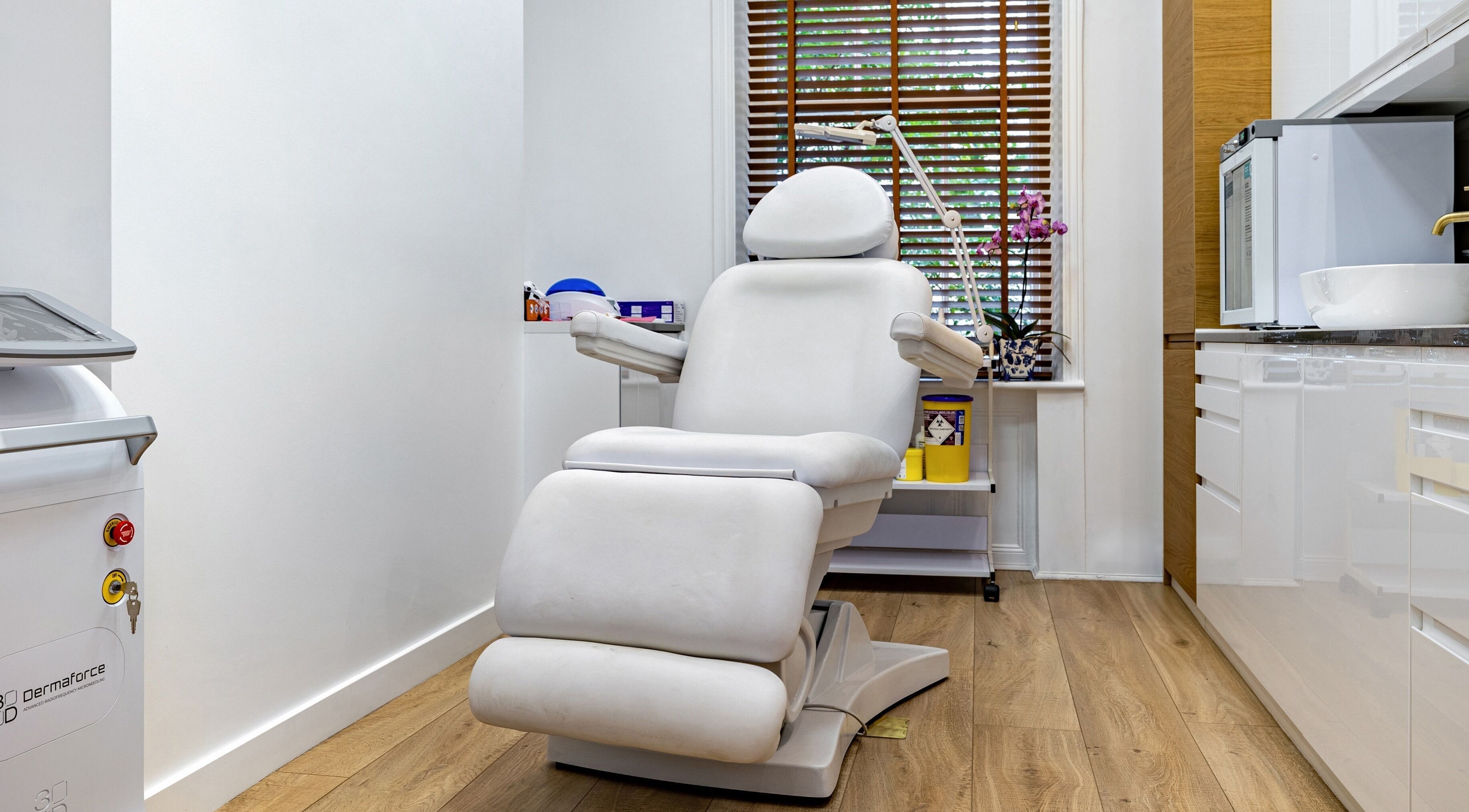 Relaxing treatment chair in Crystal Medica, London, England, GB, featuring modern wellness equipment.