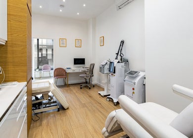 Treatment room at Crystal Medica in London, England, GB, featuring sleek decor and advanced equipment.