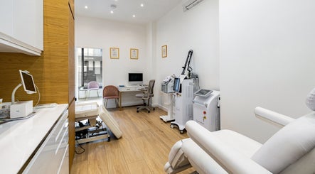 Treatment room at Crystal Medica in London, England, GB, featuring sleek decor and advanced equipment.