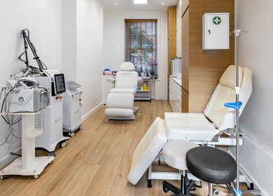 Modern wellness room at Crystal Medica, London, England, GB with advanced treatment equipment and reclining chairs.