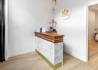 Elegant reception area at Crystal Medica in London, England, GB showcasing modern interior design.