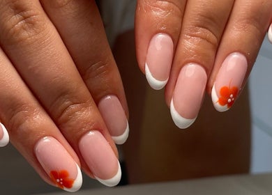 Chic floral French manicure at Nails By Jade, Worthing, England, GB. Perfect blend of elegance and style.