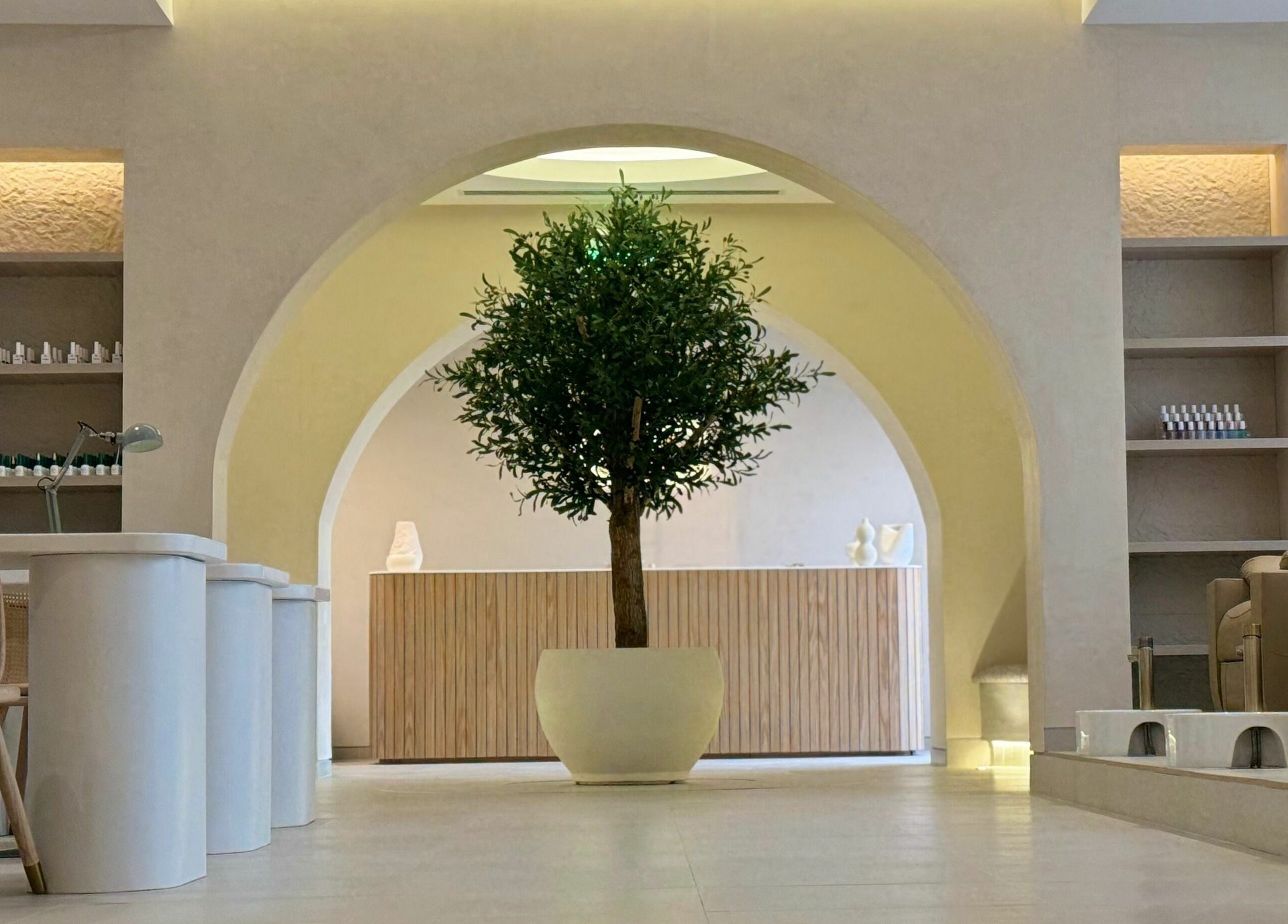 Calming interior of Etc Boutique I AlMalqa with archway and tree in Riyadh, Riyadh Province, SA.