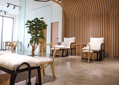 Modern lounge area at Etc Boutique Spa | Muhammadiyah in Riyadh, SA, with wooden decor and plush seating.