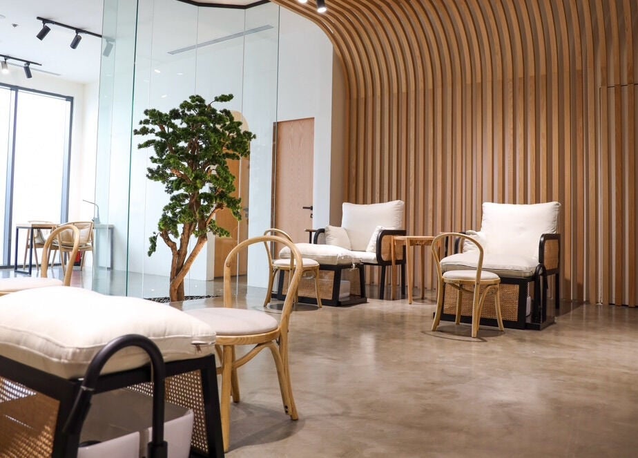Modern lounge area at Etc Boutique Spa | Muhammadiyah in Riyadh, SA, with wooden decor and plush seating.