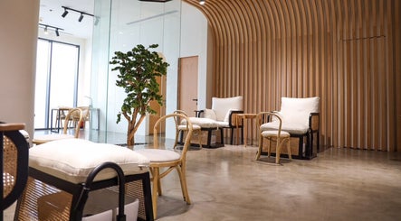 Modern lounge area at Etc Boutique Spa | Muhammadiyah in Riyadh, SA, with wooden decor and plush seating.