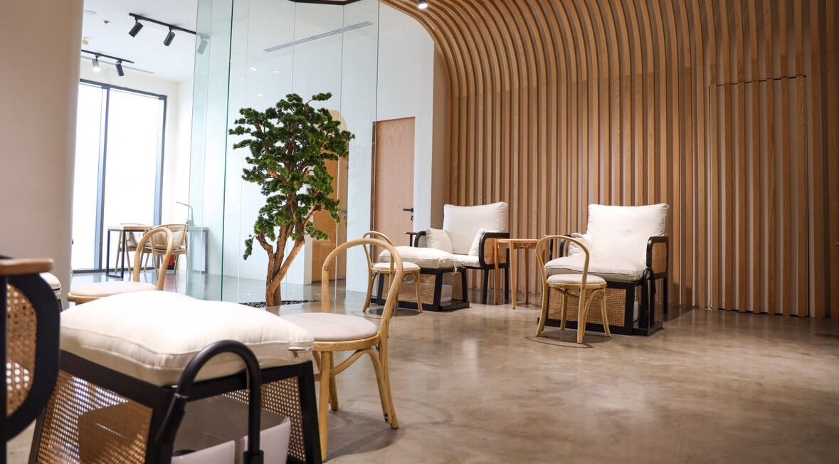 Modern lounge area at Etc Boutique Spa | Muhammadiyah in Riyadh, SA, with wooden decor and plush seating.