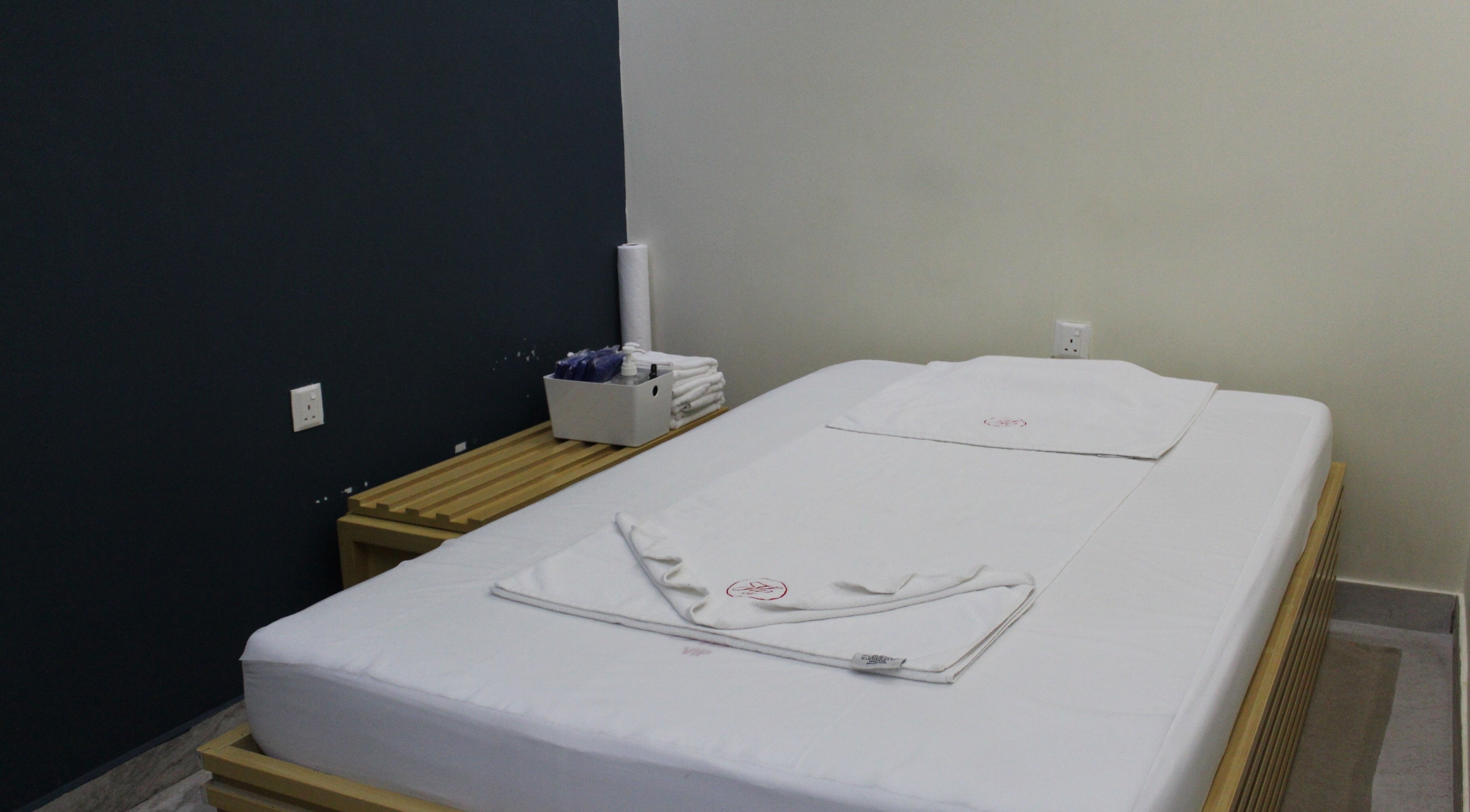Relaxing massage room at Happy Valley 34200 Ladies Oriental Bath EST, Dubai, AE with cozy white bedding and calm decor.