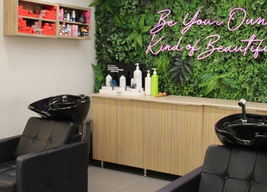 Relaxing salon chairs and lush green decor at Salaza Gibran Khabbaz, Dubai, Dubai, AE promoting beauty and wellness.