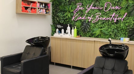Relaxing salon chairs and lush green decor at Salaza Gibran Khabbaz, Dubai, Dubai, AE promoting beauty and wellness.