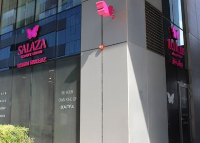 Exterior view of Salaza Gibran Khabbaz beauty salon with pink butterfly logo in Dubai, Dubai, AE.