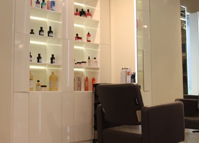 Chic salon chair and product shelf at Salaza Gibran Khabbaz, Dubai, Dubai, AE.