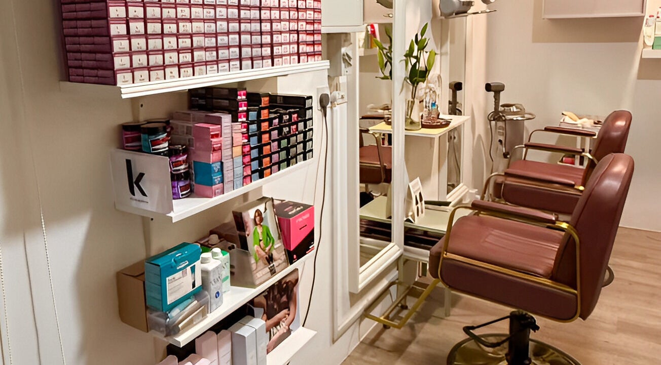 Comfortable salon chairs at HairByIsk Studio, Singapore, SG, showcasing elegant beauty space.