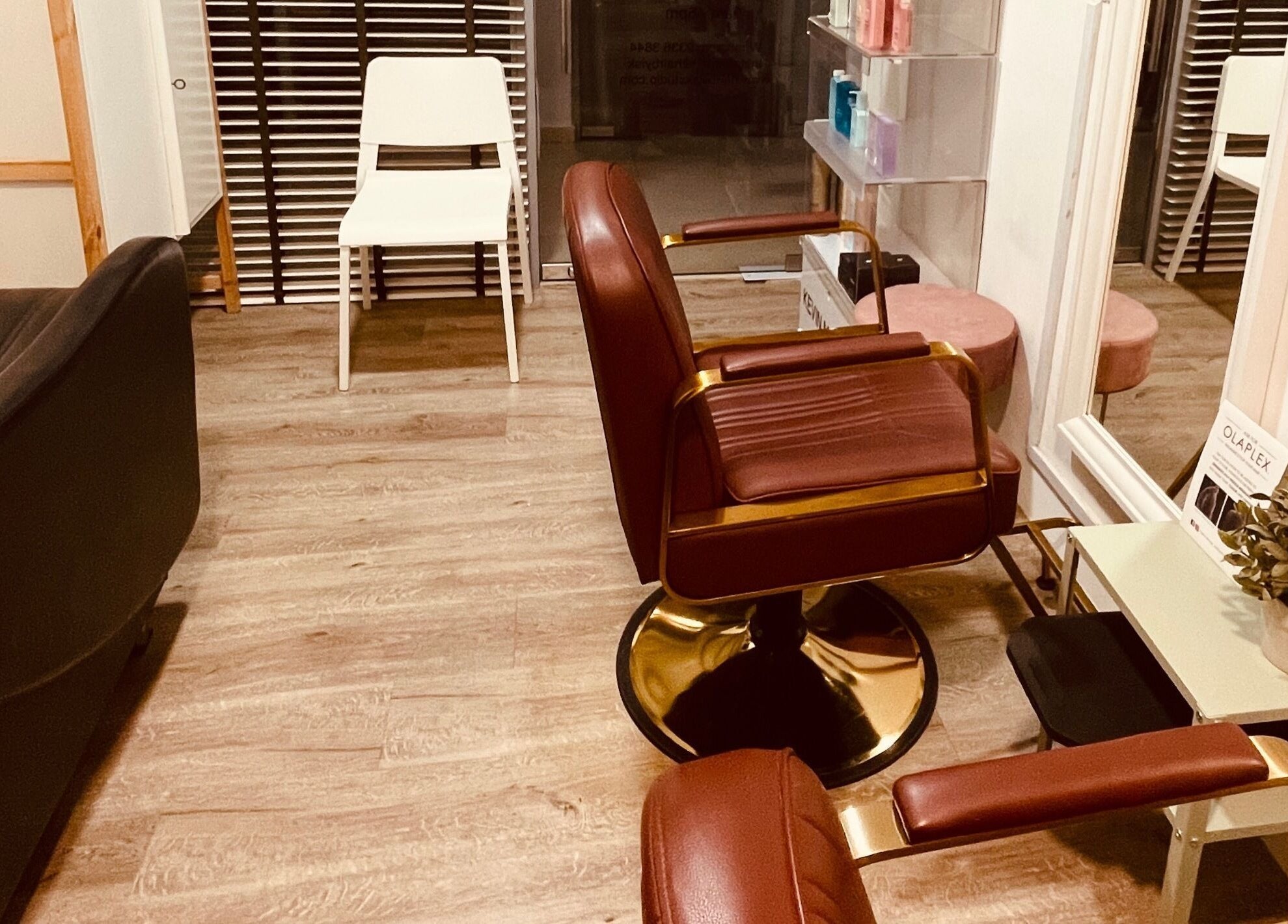 Elegant seating at HairByIsk Studio, Singapore, Singapore, SG, featuring plush chairs and modern decor.