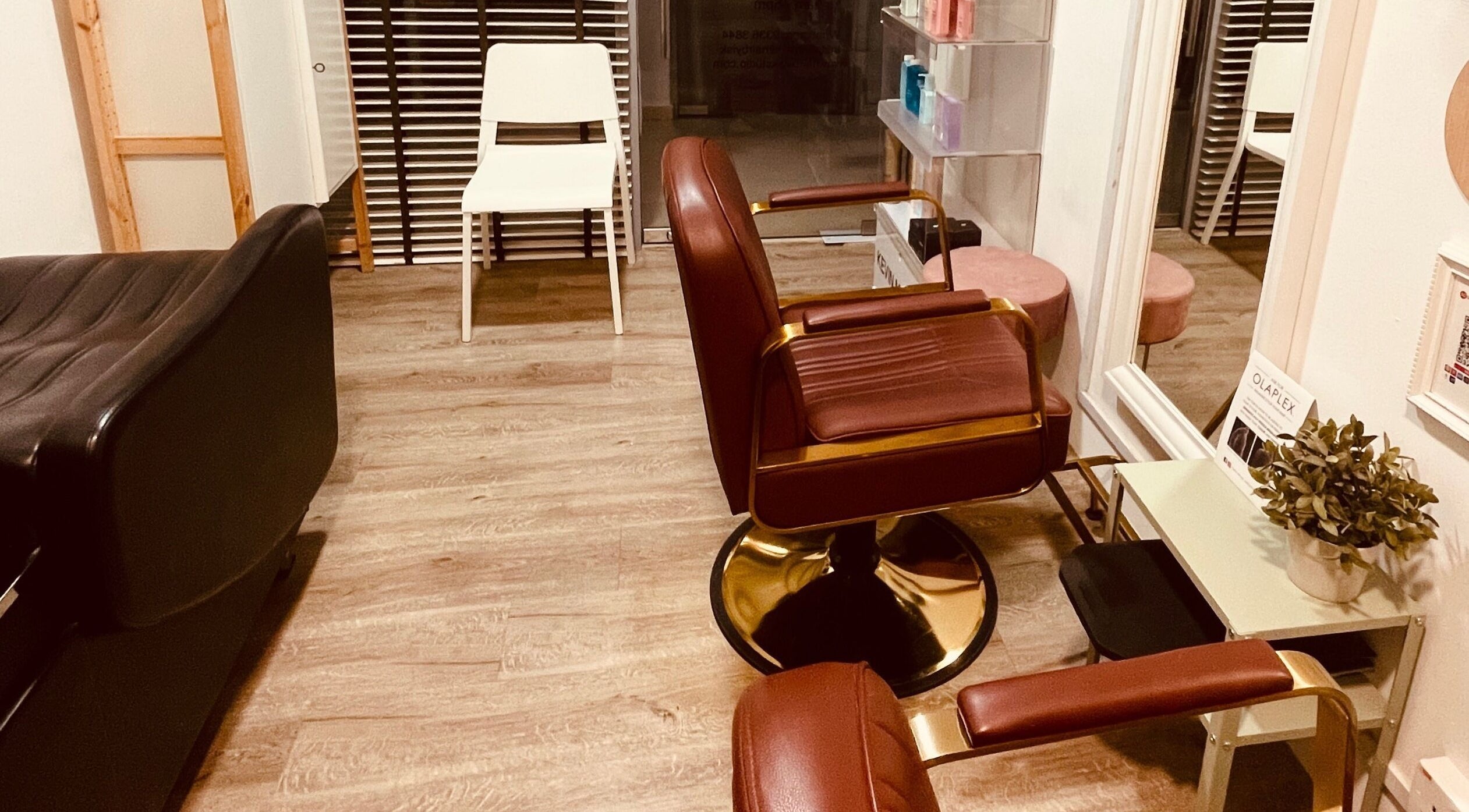 Elegant seating at HairByIsk Studio, Singapore, Singapore, SG, featuring plush chairs and modern decor.