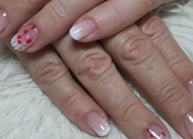 Beautiful nail art featuring red heart designs at Amazing Beauty Salon and Wellness, Pretoria, Gauteng, ZA.