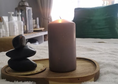 Zen stones and candle at Amazing Beauty Salon and Wellness, Pretoria, Gauteng, ZA.