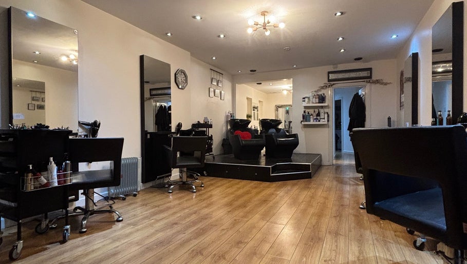 Chic salon interior at Joe Reynolds @ Lydia May in Liverpool, England, GB with modern chairs and elegant decor.