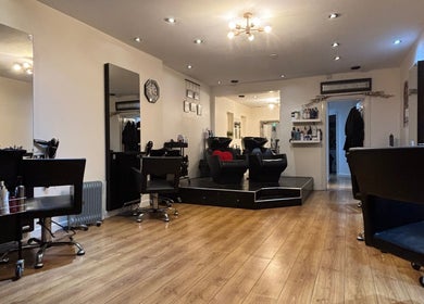 Chic salon interior at Joe Reynolds @ Lydia May in Liverpool, England, GB with modern chairs and elegant decor.