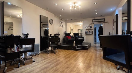 Chic salon interior at Joe Reynolds @ Lydia May in Liverpool, England, GB with modern chairs and elegant decor.