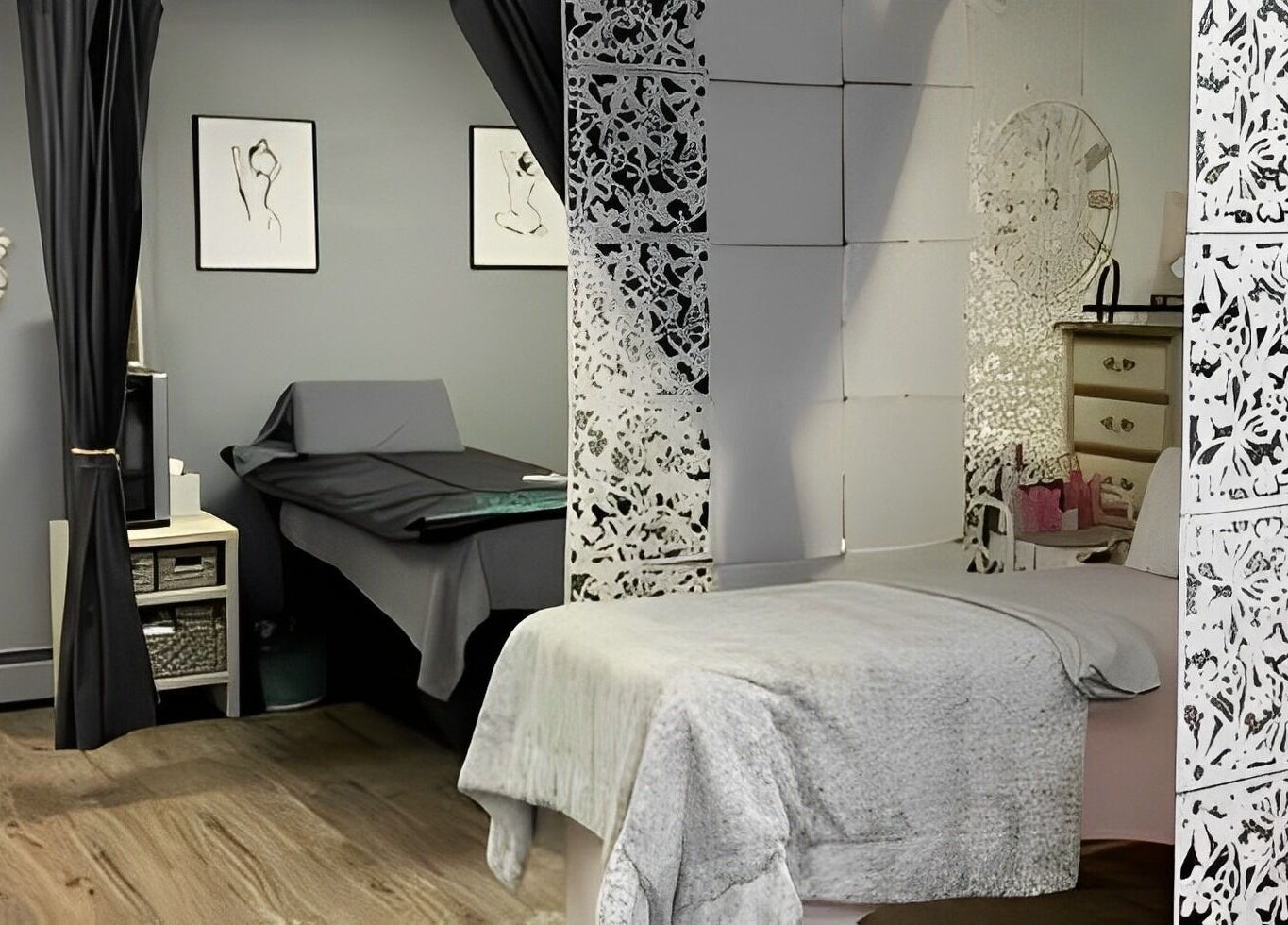 Cozy spa room at The Skin and Brow Spot in Countryside, Illinois, US with a luxurious treatment bed and decor.